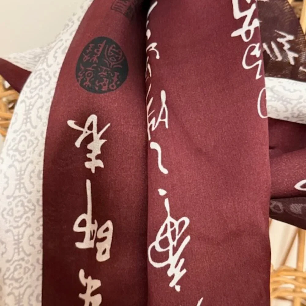Vintage 100% silk rust and gold oblong scarf.